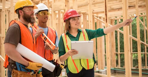 Construction crew directing second story framing by Hillstar Construction
