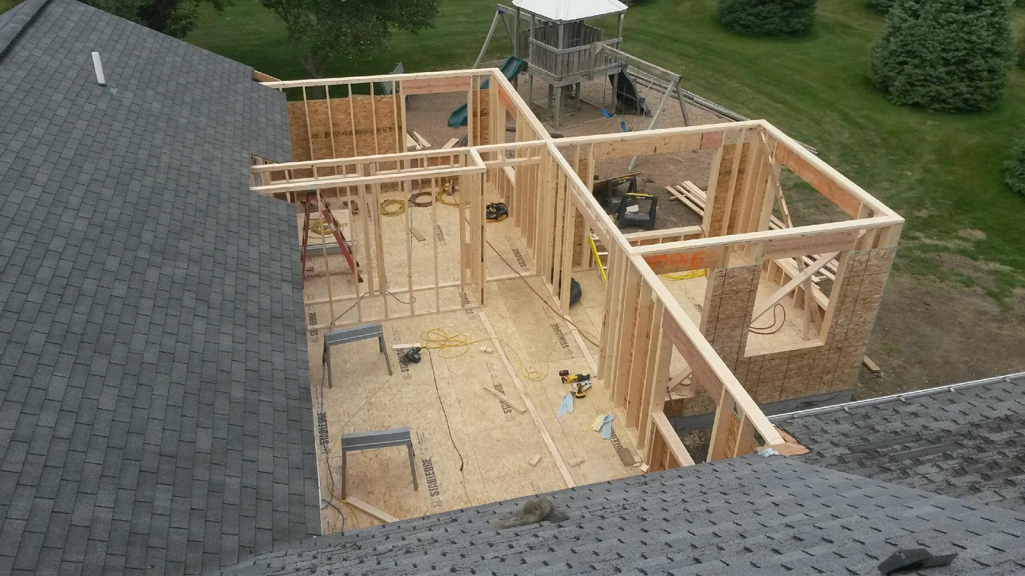 Second story addition rafter and floor framing view by Hillstar Construction