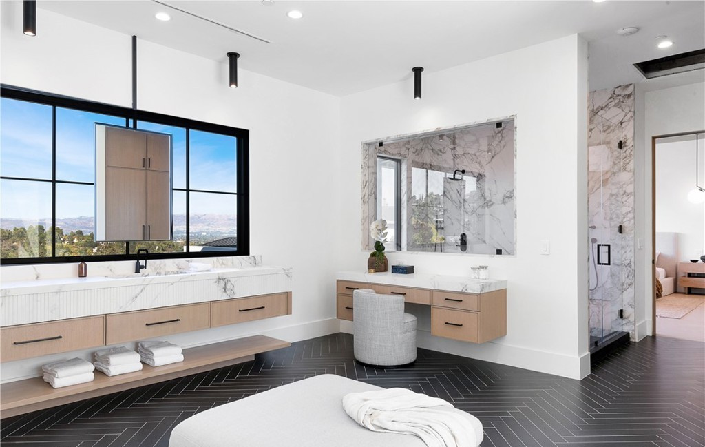 Custom master bathroom layout with walk-in shower and double vanity by Hillstar Construction