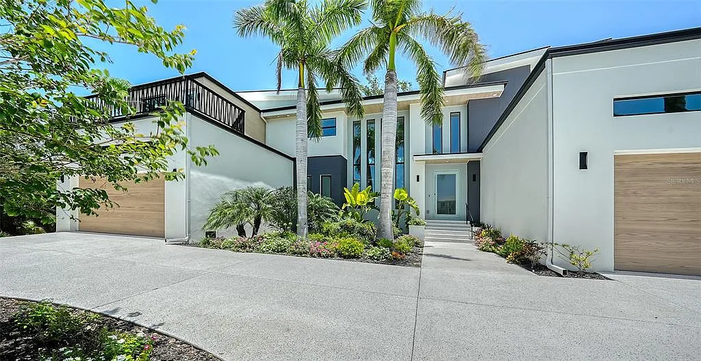 Finished concrete driveway and modern home exterior by Hillstar Construction in Los Angeles