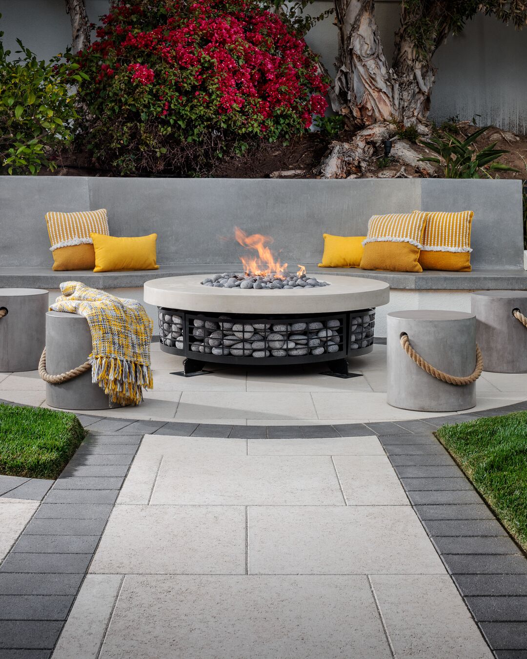 Paver patio with fire pit and seating area by Hillstar Construction in Los Angeles