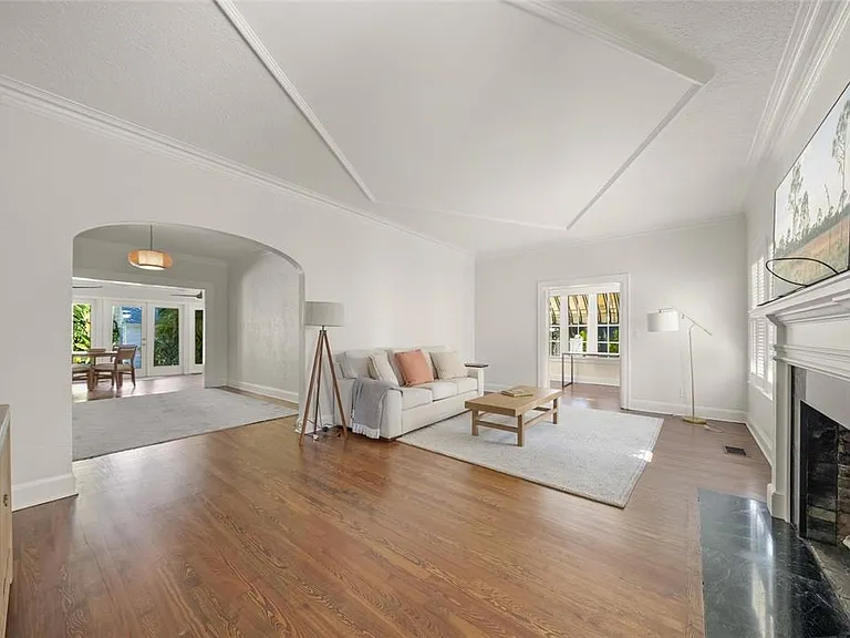 Bright open living room with clean painted walls by Hillstar Construction