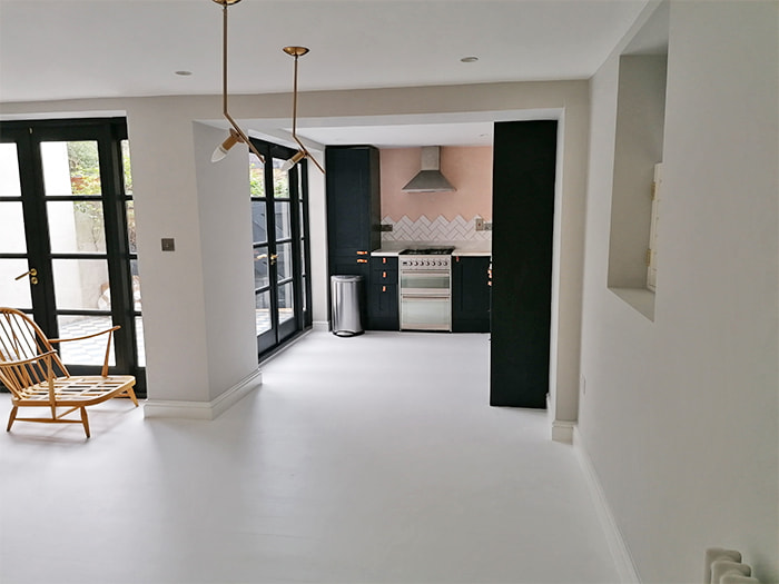 Freshly painted kitchen and living area by Hillstar Construction in Los Angeles