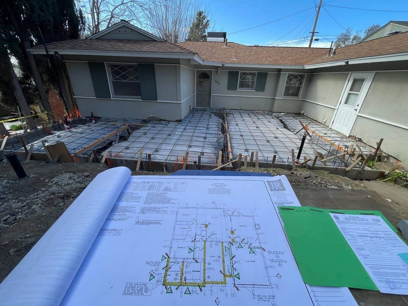 Poured ADU slab with the approved plans on site at a Hillstar Construction Inc jobsite