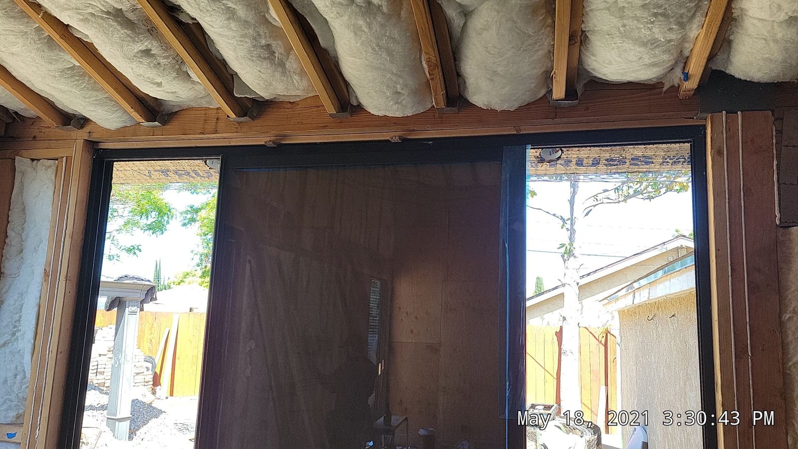 Insulation installed and a door opening framed inside a Hillstar Construction Inc conversion project