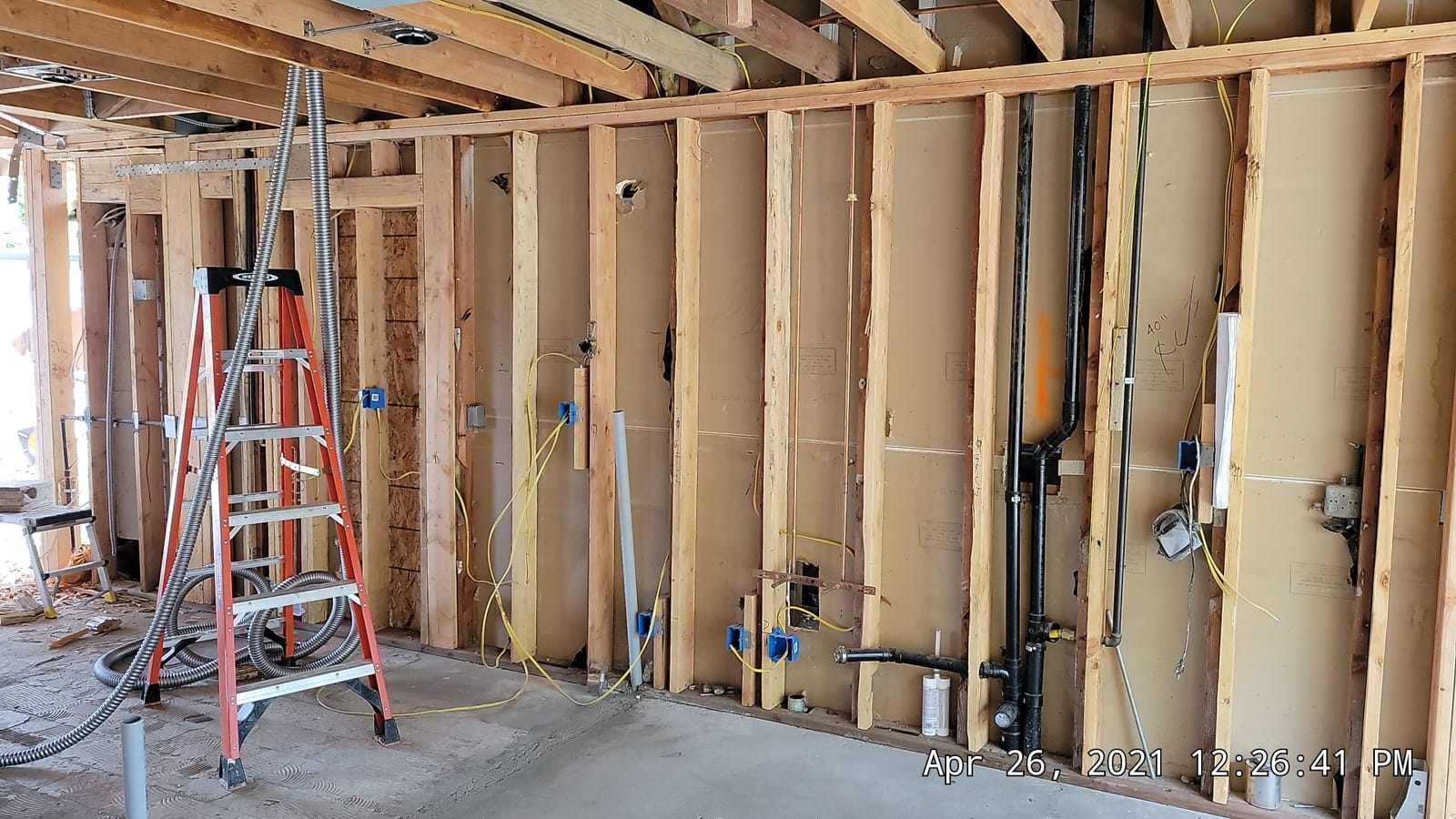 Wall framing with rough plumbing and electrical in place on a Hillstar Construction Inc jobsite