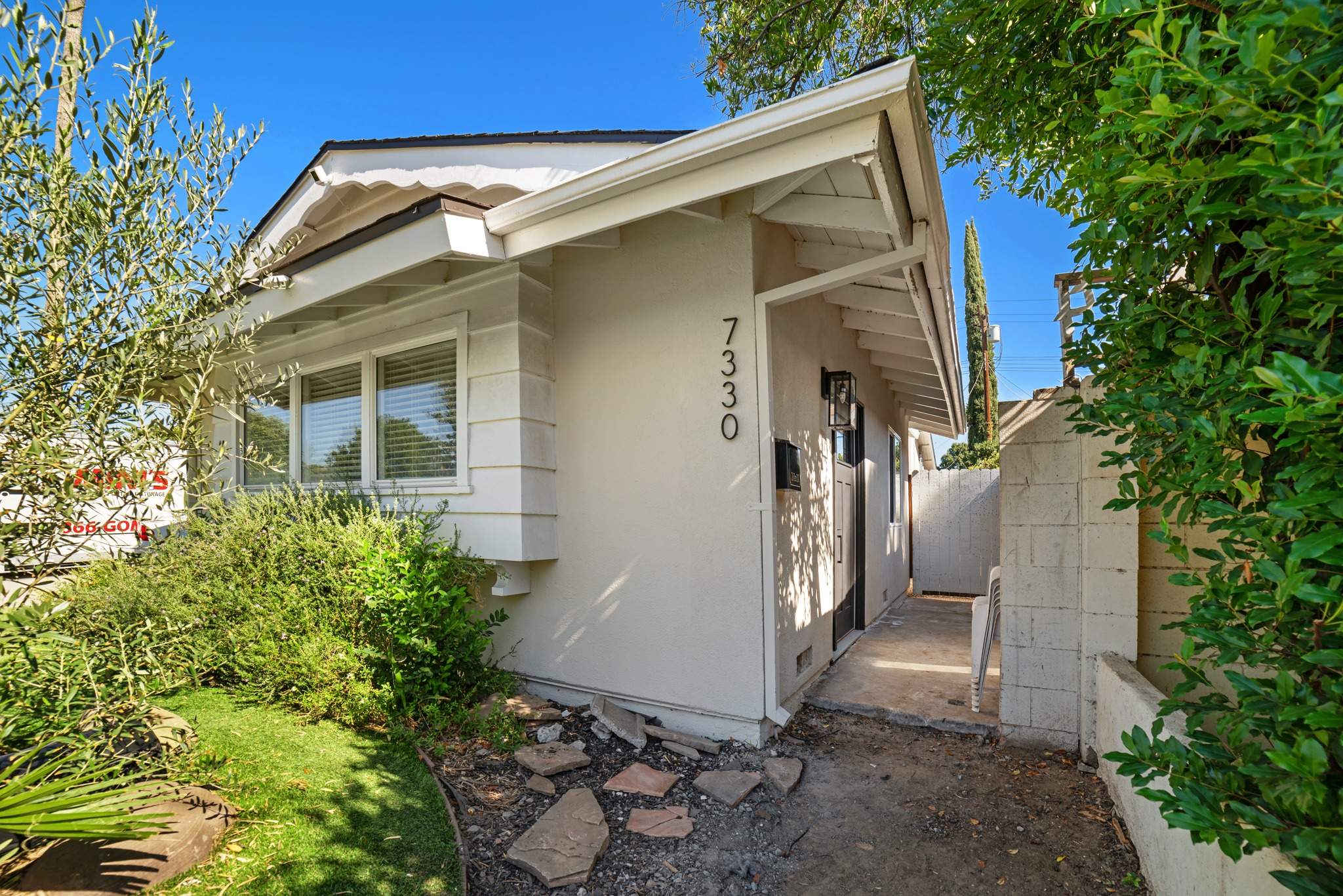 Existing home exterior before stucco remodel by Hillstar Construction