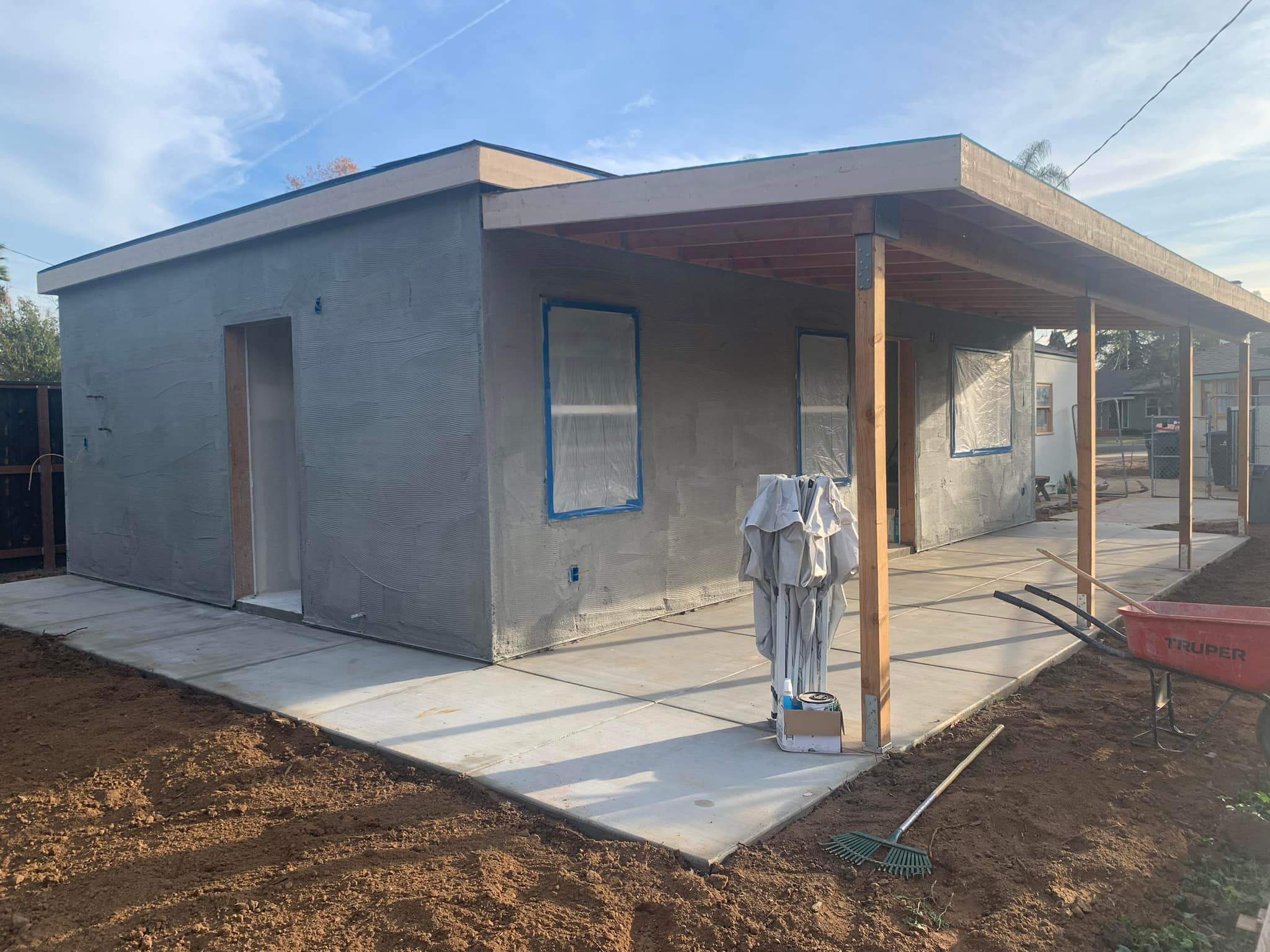 Fresh scratch coat applied on new build before color coat by Hillstar Construction